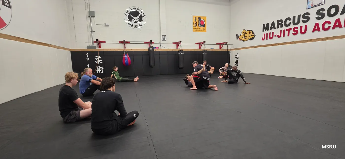 Students resting between rounds on the Langley mats