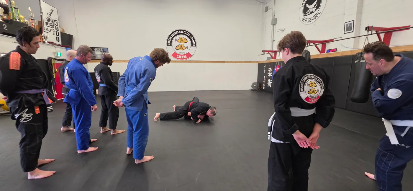 Adults drilling in pairs during an evening class in Langley