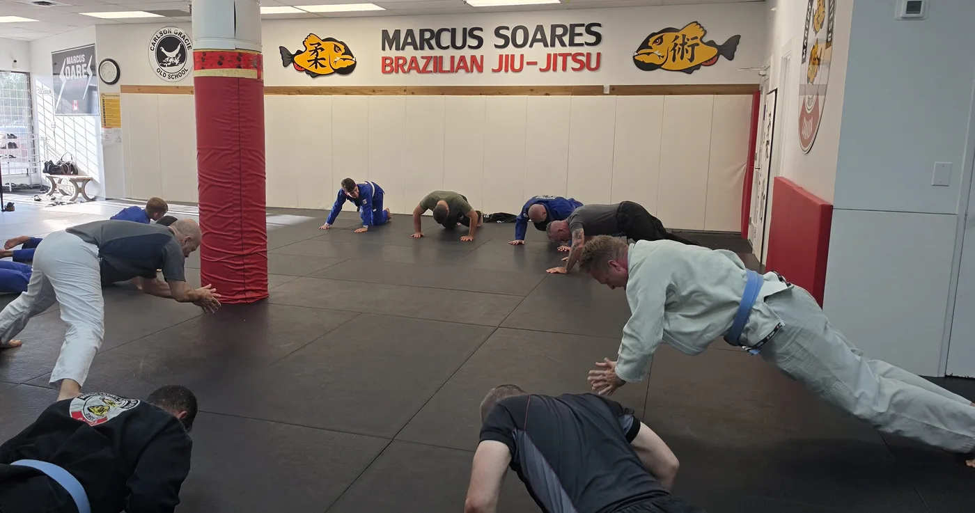 Adults warming up before class at the Maple Ridge academy