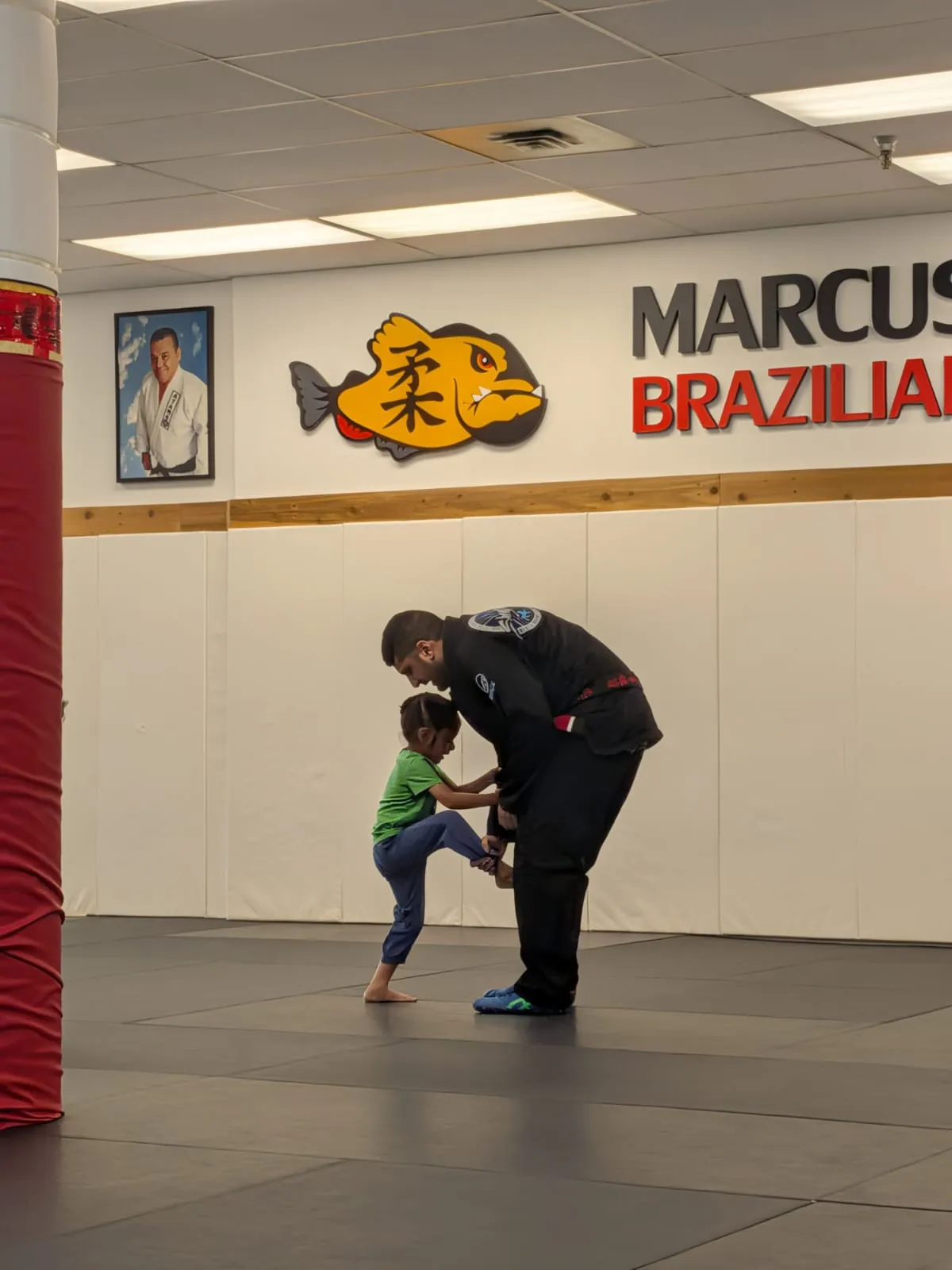 A coach helping a Lil Tots student at the Maple Ridge academy