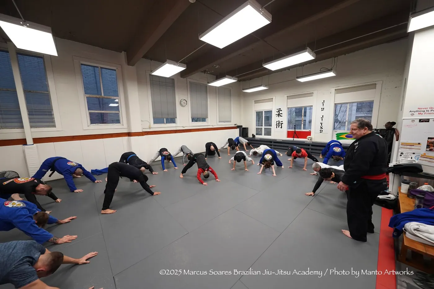 Adults warming up together at the start of a class at the Vancouver academy