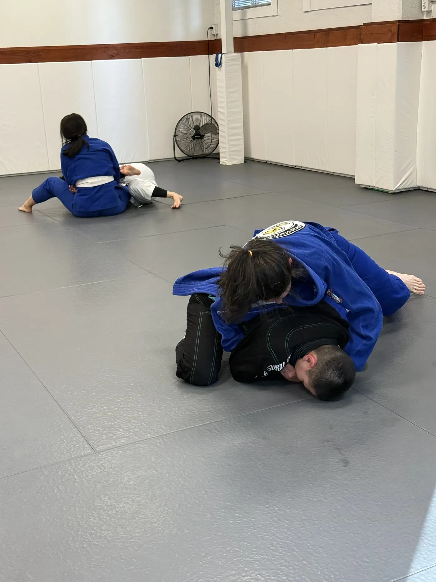 Adults rolling during an evening class at the Vancouver academy