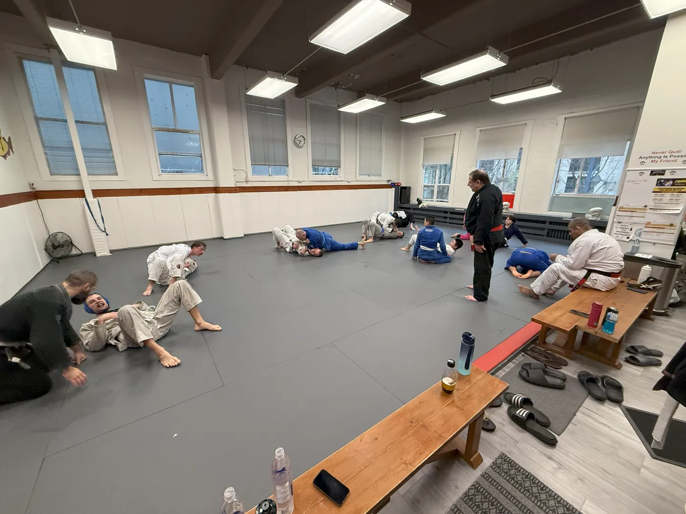Adults rolling during open mat at the Vancouver academy
