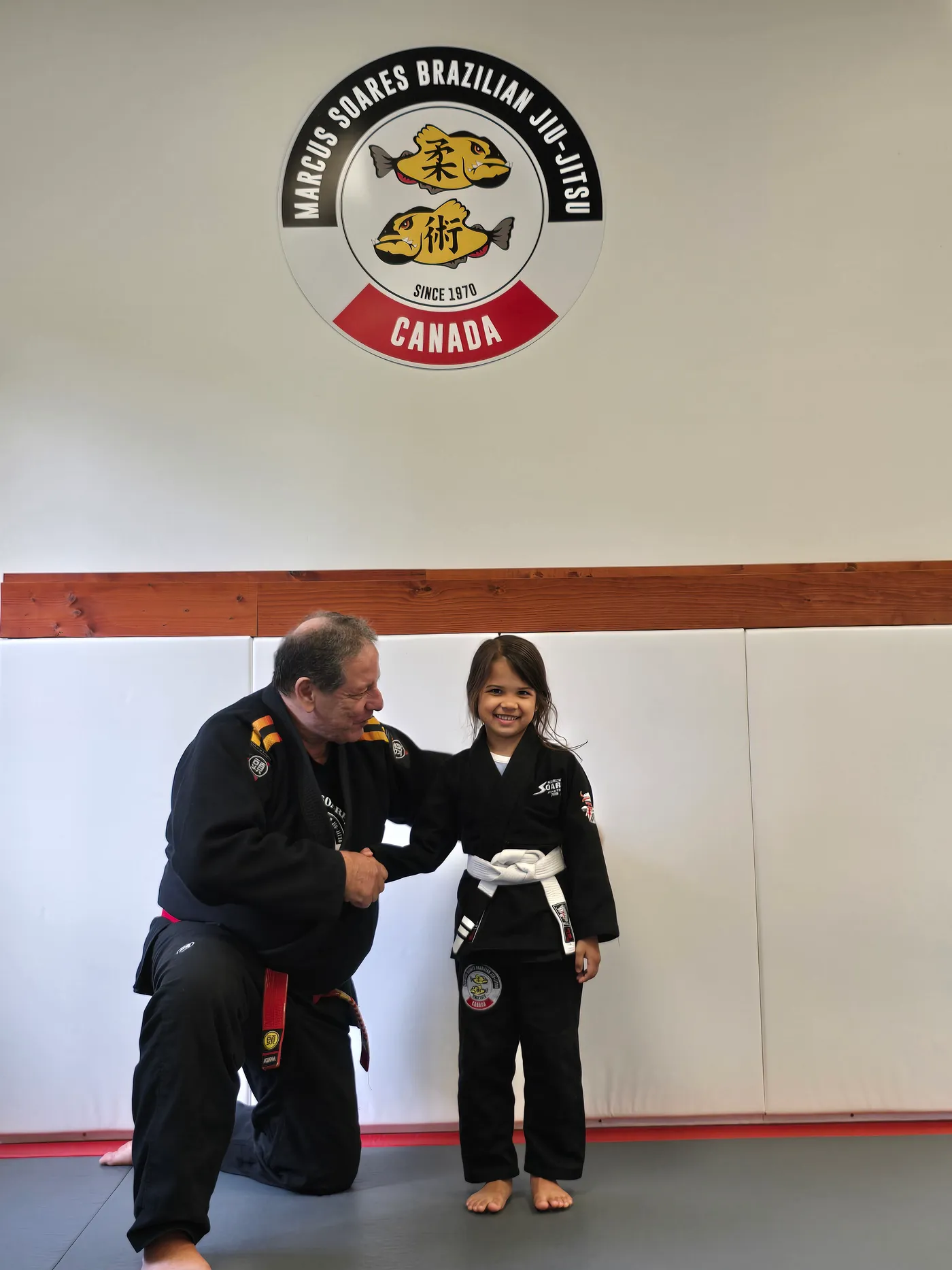 Marcus Soares with a young student at the Vancouver academy