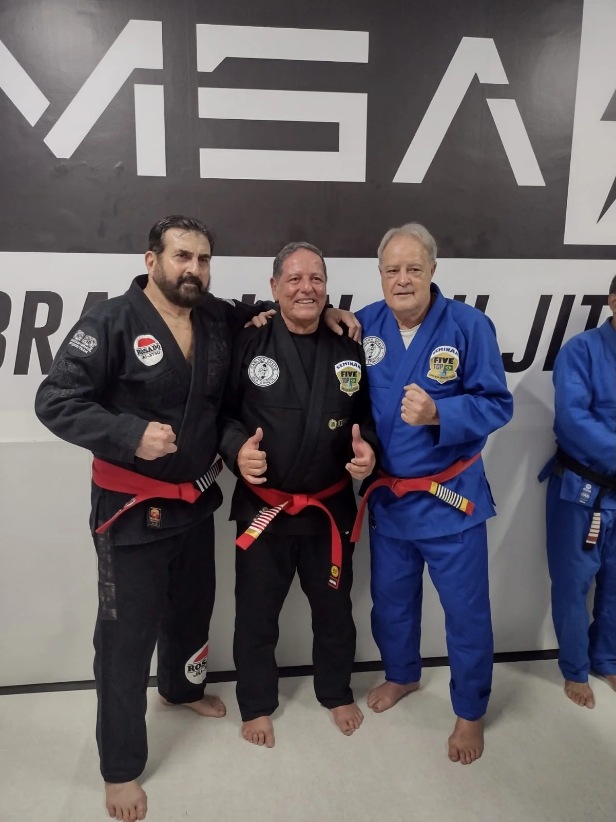 Grand Master Marcus Soares, centre, with two fellow red belts